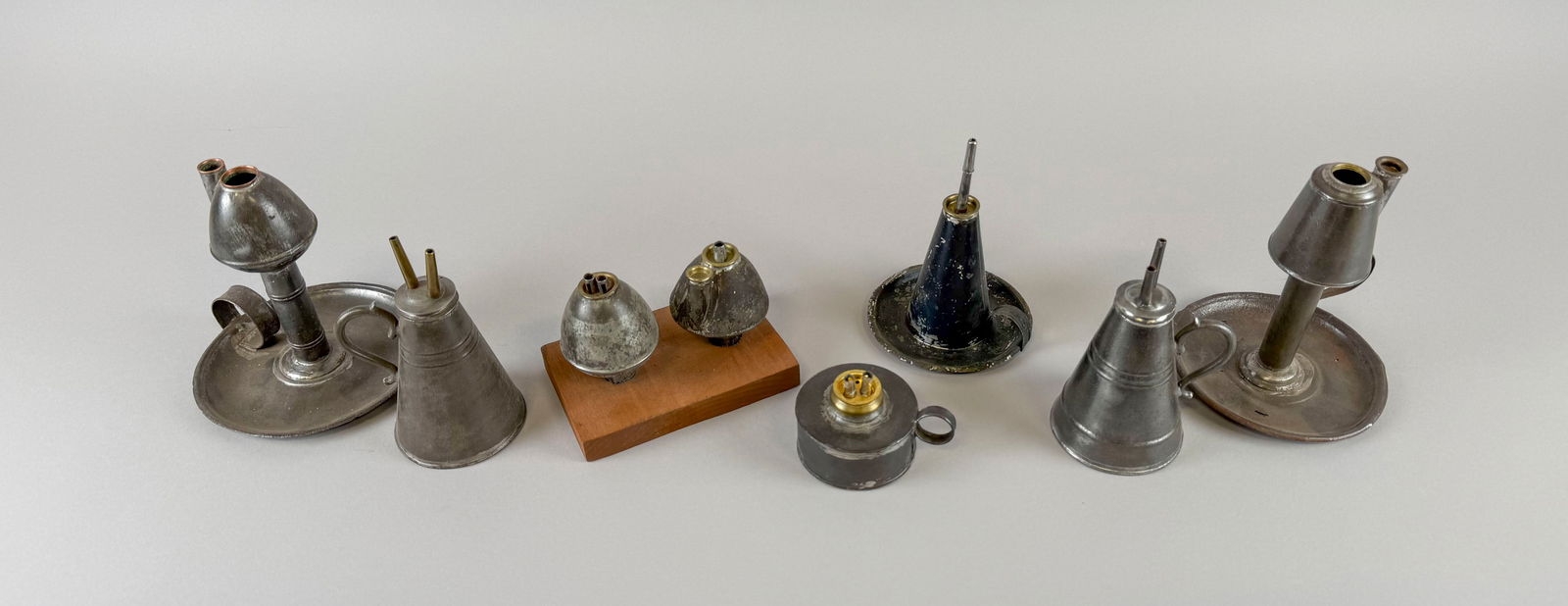 EIGHT TIN LAMPS First Half of the 19th Century Heights from 2.25" to 6.25". (1 of 1)