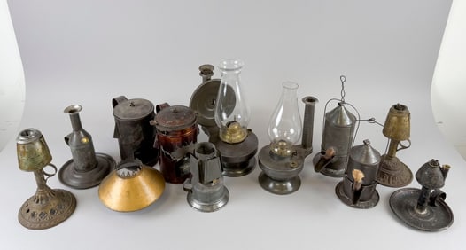 TWELVE TIN LANTERNS AND STOVES 19th Century Heights from 6.25" to 12".