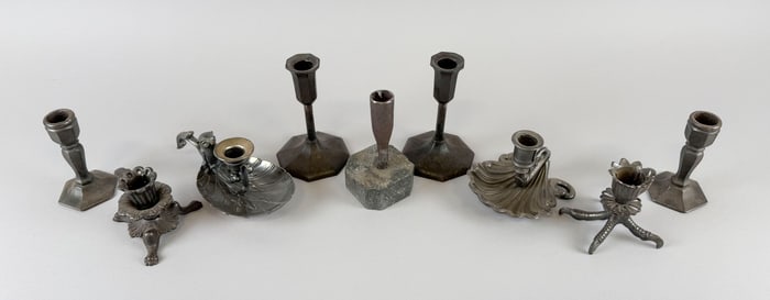 EIGHT CAST IRON CANDLESTICKS AND ONE SILVER PLATED CHAMBERSTICK Mostly 19th Century Heights from