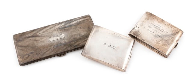 THREE STERLING SILVER CIGARETTE CASES Approx. 286.45 total dwt.