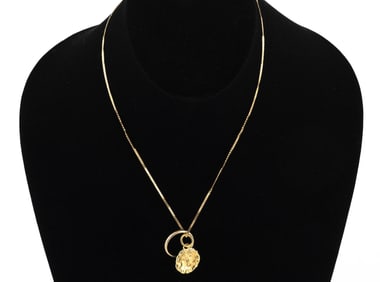 14KT YELLOW GOLD BAND AND A JEAN MAHIE 22KT YELLOW GOLD PENDANT ON CHAIN 22kt approx. 3.66 dwt.,
