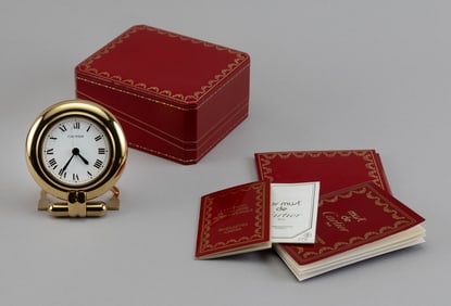 CARTIER PENDULETTE COLISEE DESK/TRAVEL ALARM CLOCK France, Early 1990s Height 3.75". Diameter 3.25".