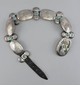 IMPRESSIVE NAVAJO SILVER AND TURQUOISE CONCHO BELT Mid-20th Century Overall length 37".
