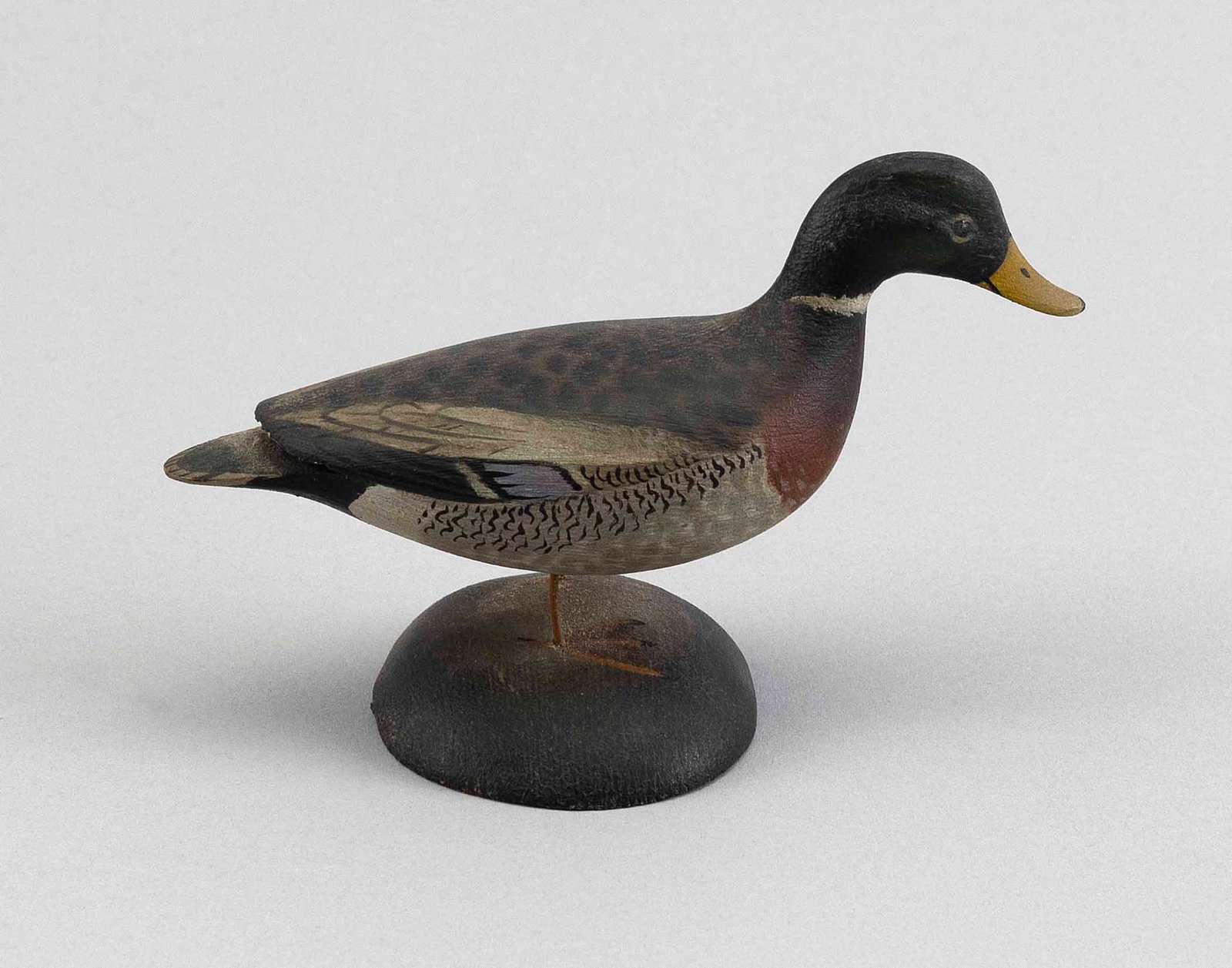 A. ELMER CROWELL MINIATURE MALLARD DRAKE East Harwich, Massachusetts, 1862-1952 Height 3.5".: A. ELMER CROWELL MINIATURE MALLARD DRAKE East Harwich, Massachusetts, 1862-1952 Circa 1928. Signed "A.E. Crowell Cape Cod". Rectangular stamp. Height 3.5".
