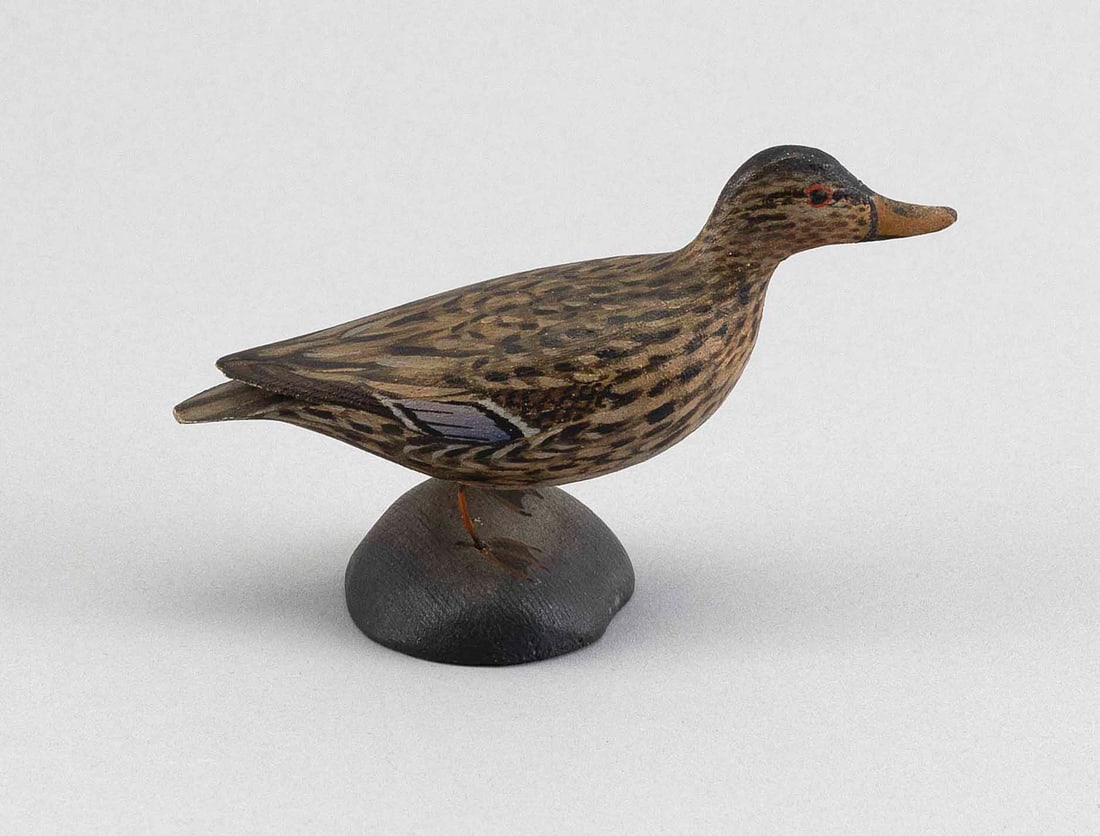 A. ELMER CROWELL MINIATURE MALLARD HEN East Harwich, Massachusetts, 1862-1952 Height 2.75".: A. ELMER CROWELL MINIATURE MALLARD HEN East Harwich, Massachusetts, 1862-1952 Circa 1930. Mounted on a round base. Height 2.75".
