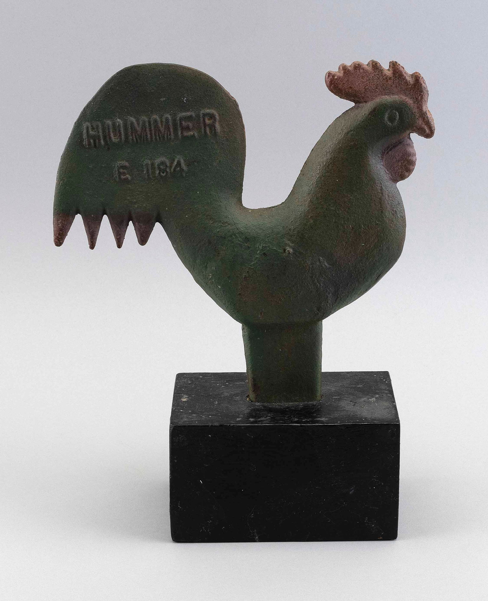 CAST IRON ROOSTER WINDMILL WEIGHT 19th Century Total height 13".: CAST IRON ROOSTER WINDMILL WEIGHT 19th Century Produced by Elgin Wind Power & Pump Co., Elgin, Illinois. Painted green and red. Long-stem example with cast "Hummer E-184" on one side of tail. Mounted 