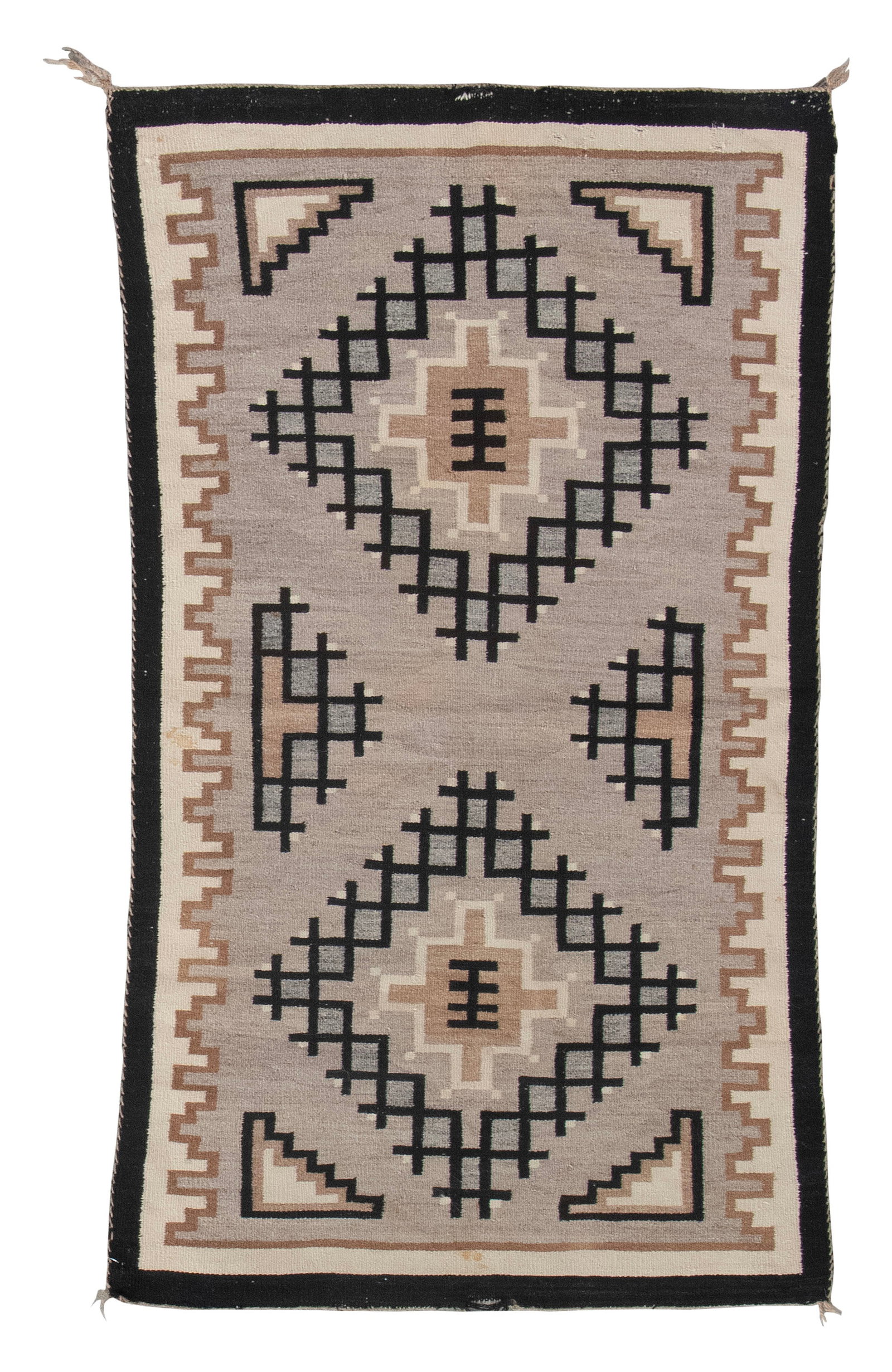 NATIVE AMERICAN RUG Late 20th Century 2'9" x 4'11".: NATIVE AMERICAN RUG Late 20th Century Light gray field contains medallions composed of black grids and tan, ivory and gray geometric elements. Tan, ivory and black borders. 2'9" x 4'11".