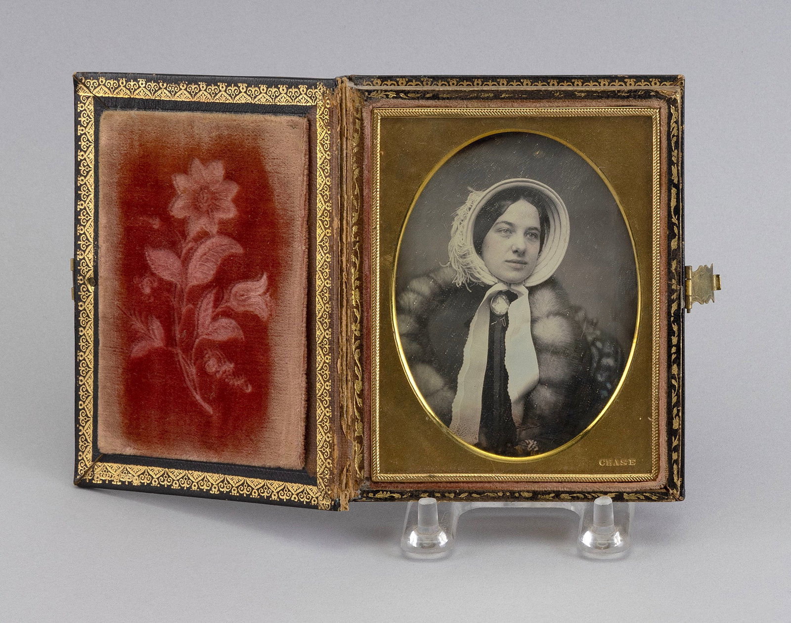 TWO CHASE OF BOSTON QUARTER-PLATE DAGUERREOTYPES OF A HUSBAND AND WIFE Circa 1930s Images approx.: TWO CHASE OF BOSTON QUARTER-PLATE DAGUERREOTYPES OF A HUSBAND AND WIFE Circa 1930s Housed together in a gilt-stamped leather case with floral design. Images approx. 3.75" x 2.75" sight. Case 4.75" x 3