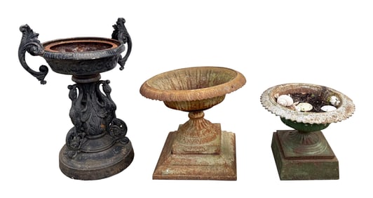 THREE CAST IRON PLANTERS Early 20th Century Heights from 17" to 38".