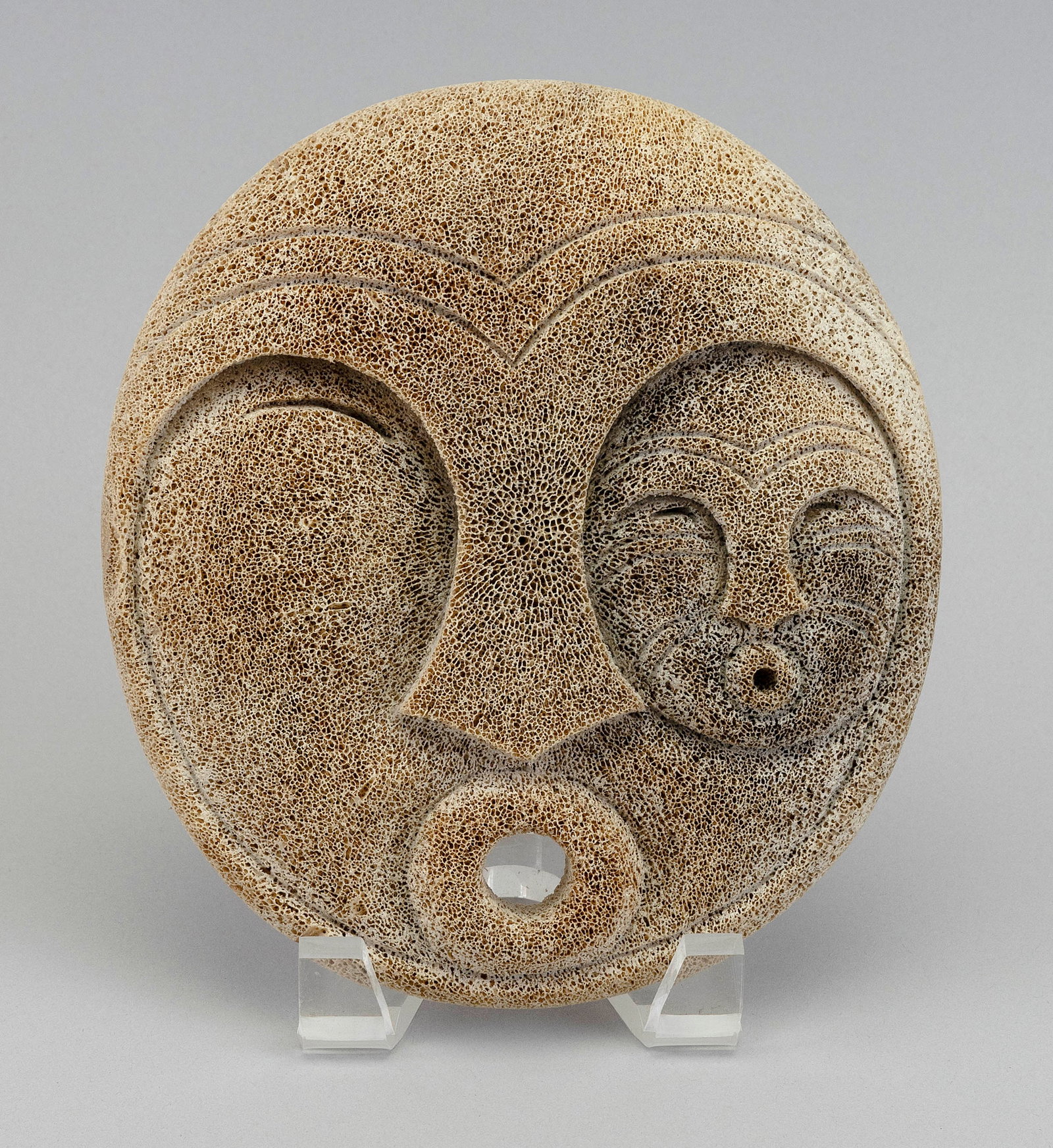 INUIT CARVED WHALE VERTEBRA MASK/PLAQUE Early 20th Century 7.5" x 6.75".: INUIT CARVED WHALE VERTEBRA MASK/PLAQUE Early 20th Century Signed on reverse "Bailey". 7.5" x 6.75".