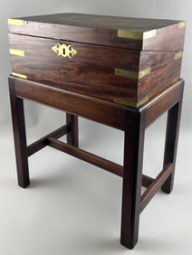 BRASS-BOUND MAHOGANY LAP DESK ON STAND 19th Century Desk height 6.75". Width 16.5". Depth 10.5".