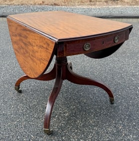 SHERATON-STYLE MAHOGANY DROP-LEAF CENTER TABLE Late 19th Century Height 29". Length 23" to 50.25".