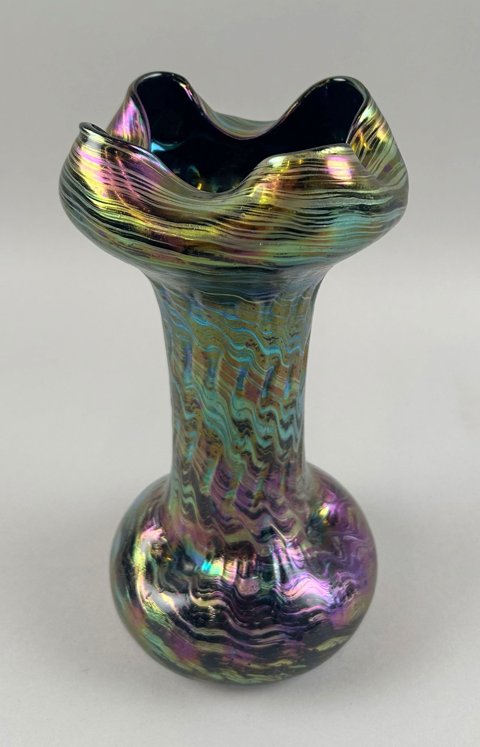 LOETZ-STYLE IRIDESCENT GLASS VASE 20th Century Height 9.5".: LOETZ-STYLE IRIDESCENT GLASS VASE20th CenturyPinched rim and base. Unsigned.Height 9.5".