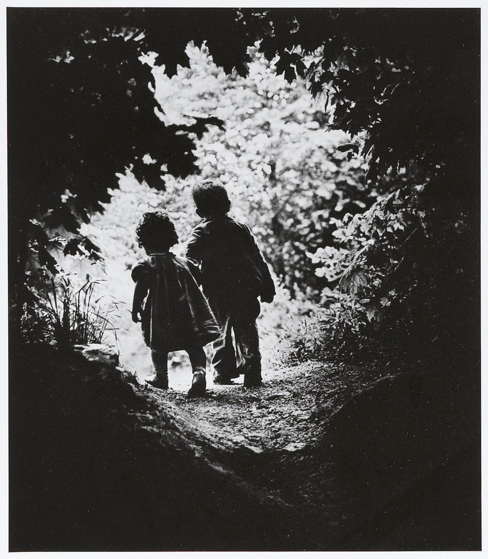 W. EUGENE SMITH (Arizona/Kansas, 1918-1978), "Walk to Paradise Garden", 1948., Silver print, image: W. EUGENE SMITHArizona/Kansas, 1918-1978"Walk to Paradise Garden", 1948. Printed circa 1970. Notations in pencil in an unknown hand verso.Silver print, image 12" x 10", sheet slightly larger. Framed 1