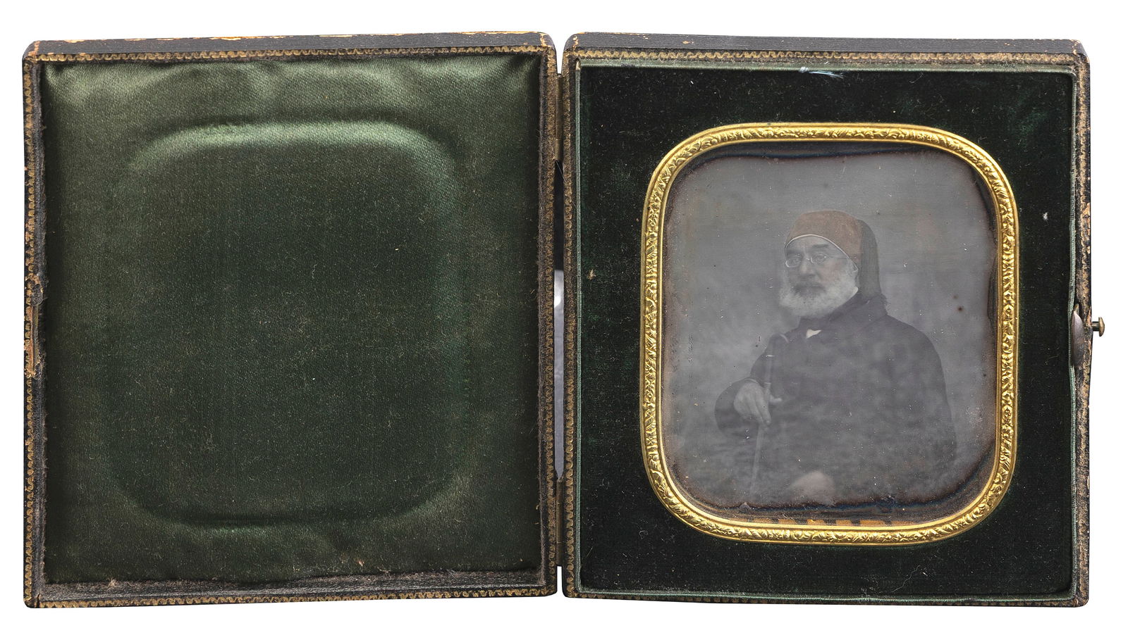 QUARTER PLATE DAGUERREOTYPE OF A DISTINGUISHED GENTLEMAN HOLDING A CANE Circa 1930s 3.25" x 4.25". (1 of 2)