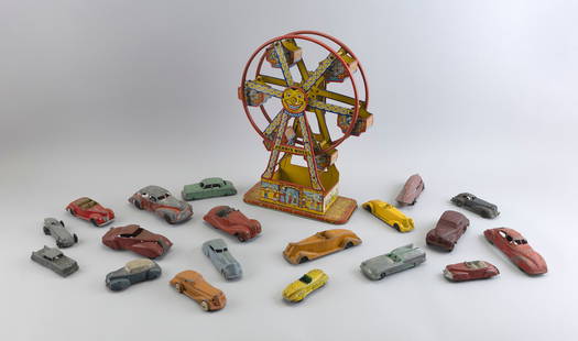 J. CHEIN "HERCULES" TIN LITHOGRAPHED FERRIS WHEEL WIND-UP TOY, AND EIGHTEEN CAST METAL TOY CARS: J. CHEIN "HERCULES" TIN LITHOGRAPHED FERRIS WHEEL WIND-UP TOYAND EIGHTEEN CAST METAL TOY CARSCirca 1930sHeight 16.5". Provenance:The Collection of Rodolfo Machado and Jorge Silvetti.