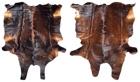TWO COWHIDE RUGS 98" x 91" and 86" x 71".