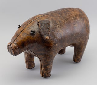 DIMITRI OMERSA (1927-1985) BROWN LEATHER PIG FOOTSTOOL Length 21".