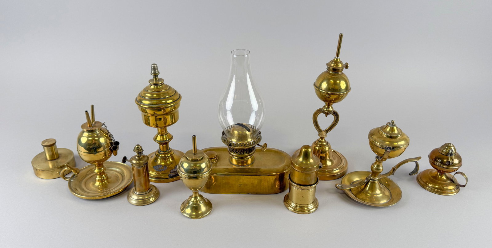 TEN BRASS LAMPS Mostly 19th Century Heights from 2.75" to 10.5".: TEN BRASS LAMPS Mostly 19th Century Varied forms. Heights from 2.75" to 10.5".