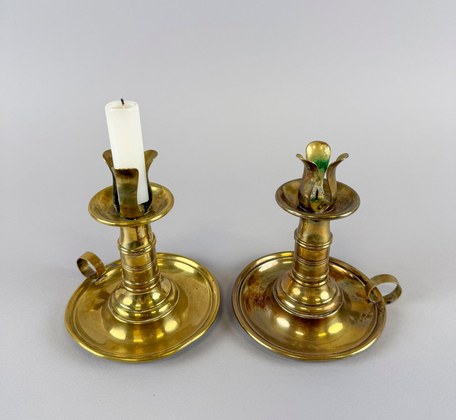 PAIR OF BRASS SAUCER-BASE CANDLESTICKS Late 19th Century Heights 6". (1 of 1)