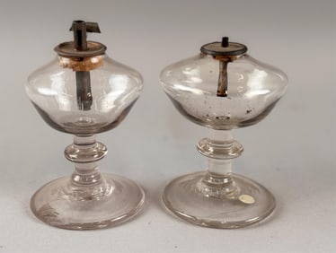 PAIR OF CLEAR BLOWN GLASS SPARKING LAMPS Early 19th Century Heights 3.5" and 3.75".