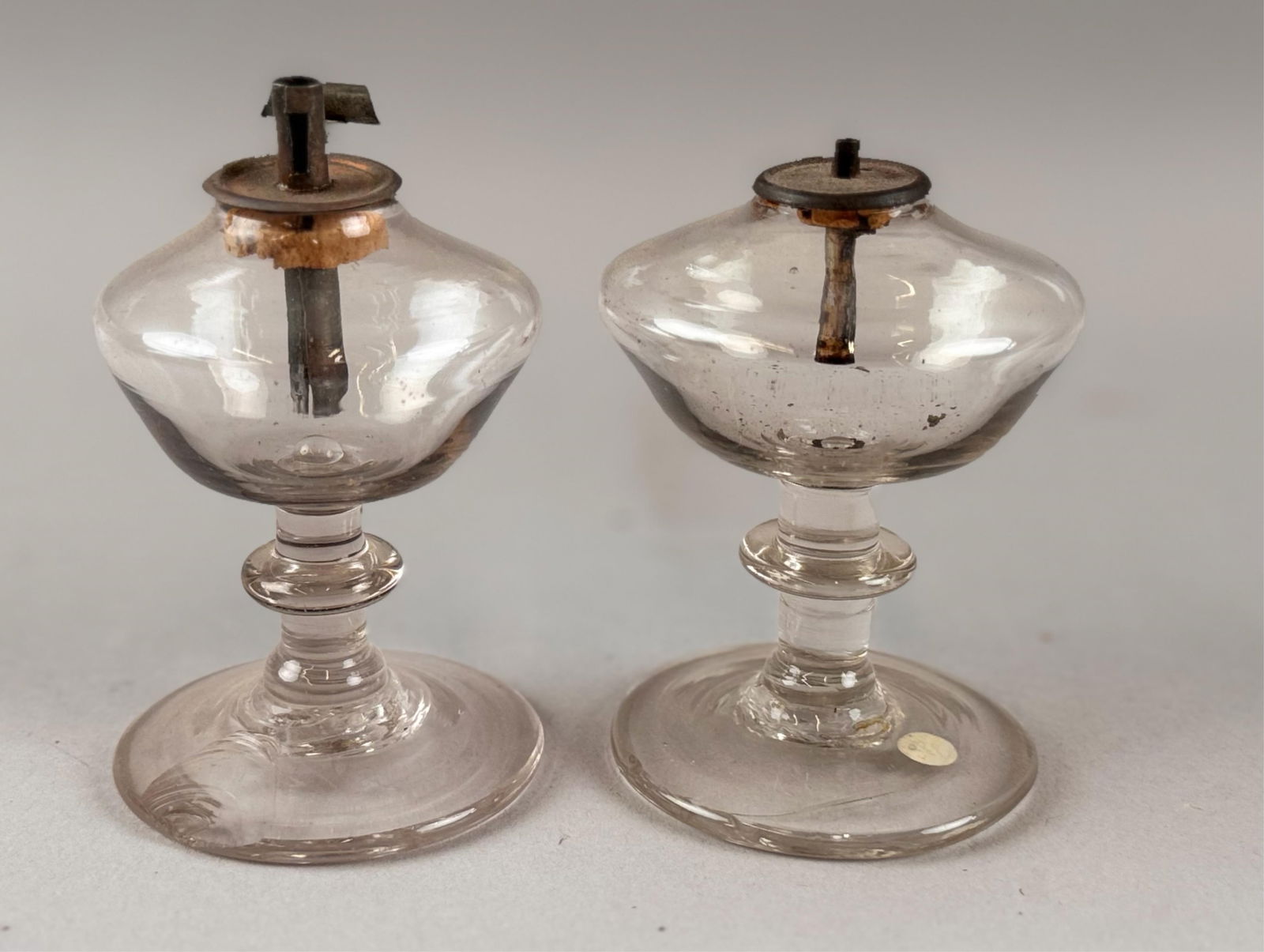 PAIR OF CLEAR BLOWN GLASS SPARKING LAMPS Early 19th Century Heights 3.5" and 3.75". (1 of 3)