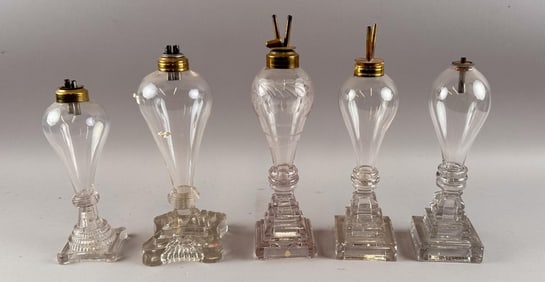 FIVE CLEAR BLOWN AND PRESSED GLASS LAMPS First Half of the 19th Century Heights from 9.75" to