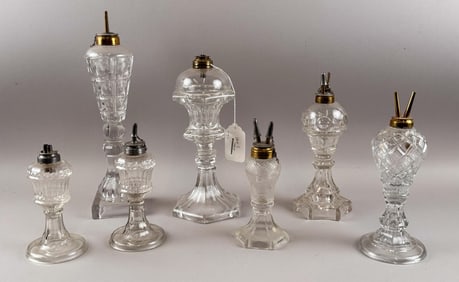 SEVEN FLINT PATTERN GLASS WHALE OIL LAMPS 19th Century Heights from 6.75" to 14".