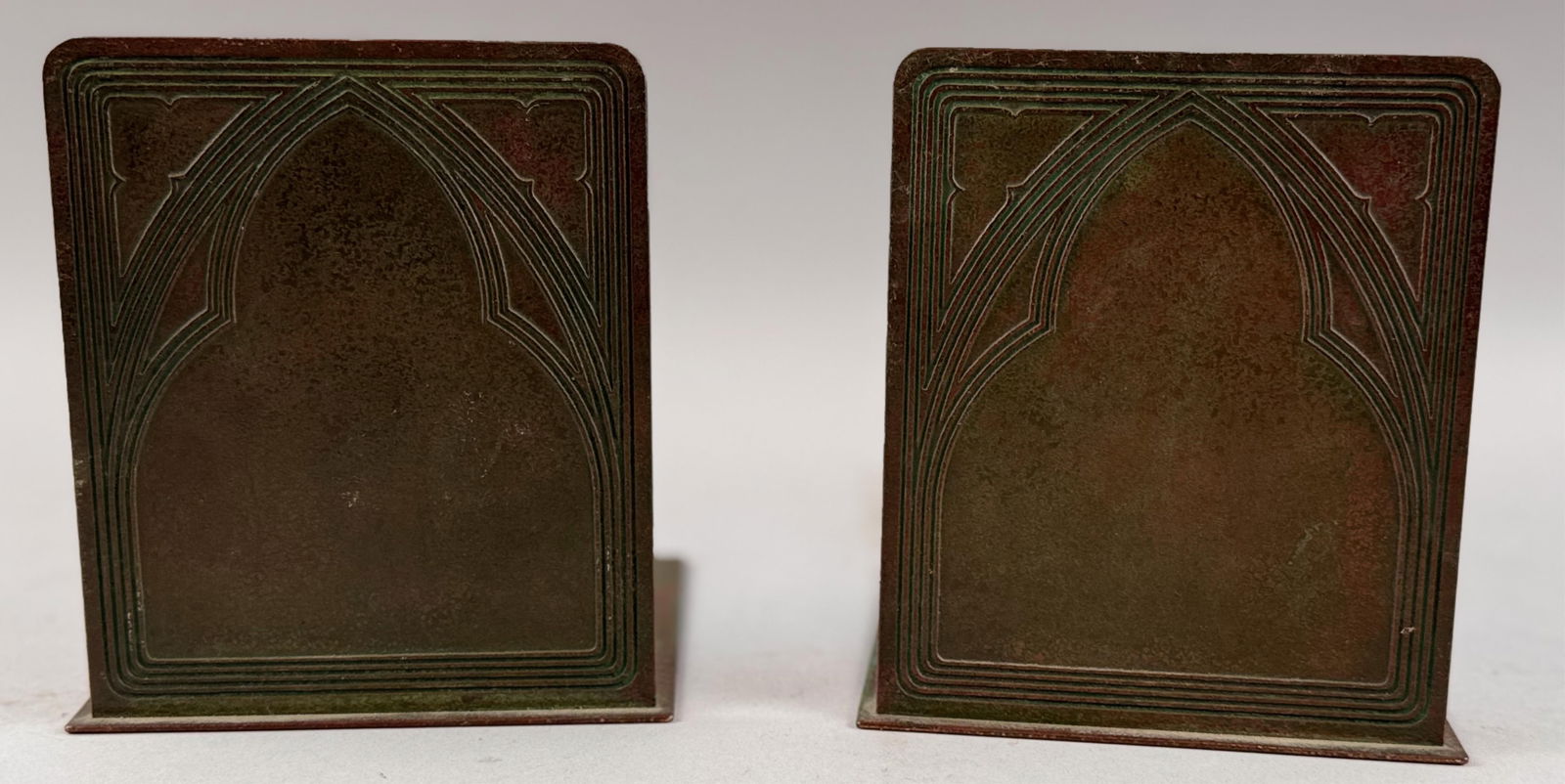 PAIR OF TIFFANY STUDIOS "GRADUATE" BRONZE BOOKENDS New York, Early 20th Century Heights 5.75". (1 of 4)