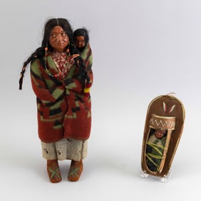 TWO SKOOKUM DOLLS Circa 1950s Squaw height 15". Papoose length 7.5".