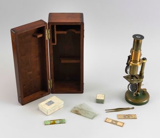 BRASS MICROSCOPE IN A MAHOGANY CASE 19th Century Height 9.5".