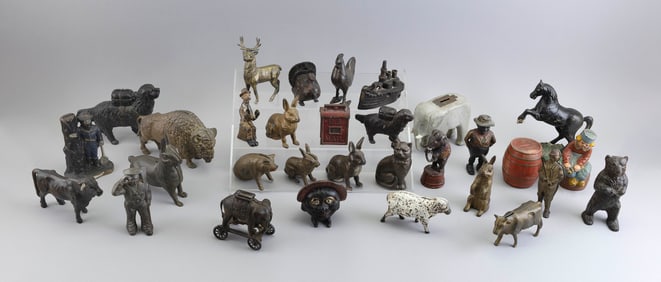 THIRTY-ONE STILL BANKS, MOSTLY CAST IRON Late 19th/Early 20th Century Heights from 3.5" to 7".
