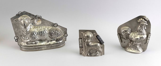THREE TIN ANIMAL-FORM CHOCOLATE MOLDS Early 20th Century Lengths from 5" to 11".