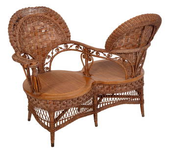 RARE VICTORIAN WICKER "GOSSIP" OR T?TE-?-T?TE CHAIR America, Late 19th Century Back height 37". Seat: RARE VICTORIAN WICKER "GOSSIP" OR T?TE-?-T?TE CHAIRAmerica, Late 19th CenturyAttributed to Heywood-Wakefield Co.Back height 37". Seat height 16". Length 48". Provenance:The Collection of Gordon Hyatt.
