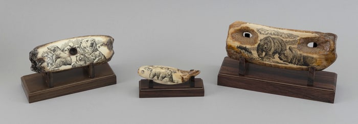THREE ENGRAVED FOSSILIZED WALRUS TUSKS BY ROBERT MONFILS 20th Century Lengths from 3.75" to 6.5". On