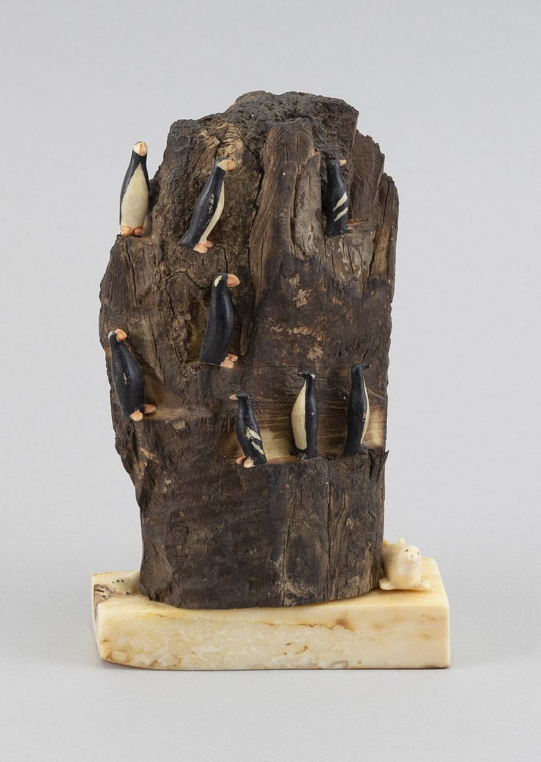 CARVED FOSSILIZED WALRUS IVORY SCULPTURE 20th Century Height 5.5". Width 3.5".: CARVED FOSSILIZED WALRUS IVORY SCULPTURE 20th Century Formed as puffins and seals on rockery. Unsigned but accompanying note attributes the work to Cottie Burland. Height 5.5". Width 3.5".