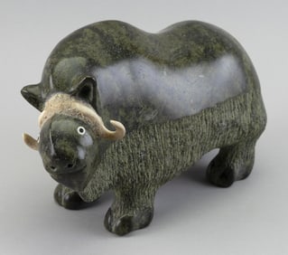 INUIT CARVED SOAPSTONE MUSKOX BY SEEPEE IPELLIE Iqaluit, Frobisher Bay, Nunavut, 1940- Height 6.5".