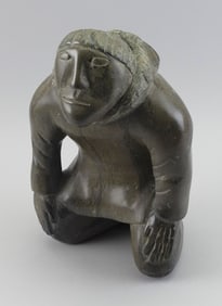 INUIT CARVED SOAPSTONE FIGURE BY JAMASIE KOOTOO Kimmirut, Lake Harbor, Nunavut, 1944- Height 13.5".