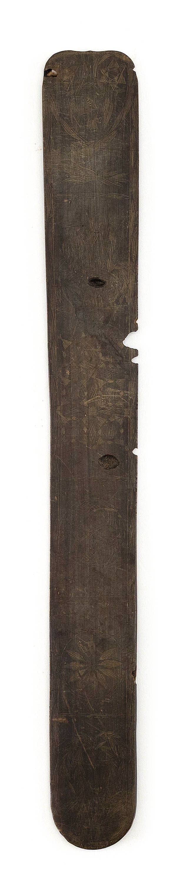 SCRIMSHAW BALEEN BUSK, 19th Century Length 13".: SCRIMSHAW BALEEN BUSK 19th Century Faint images include hex designs, willow trees, and a heart containing an eagle and six-pointed stars. Geometric and foliate borders. Length 13".