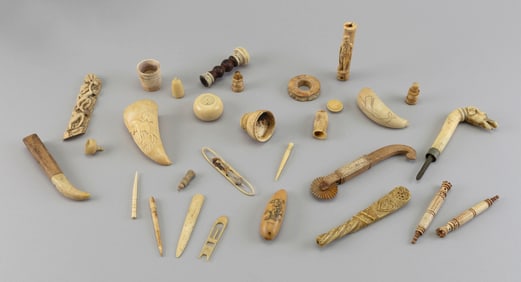 APPROX. TWENTY-SIX WHALE IVORY AND WHALEBONE CARVINGS 19th Century Lengths from 1" to 6.25".
