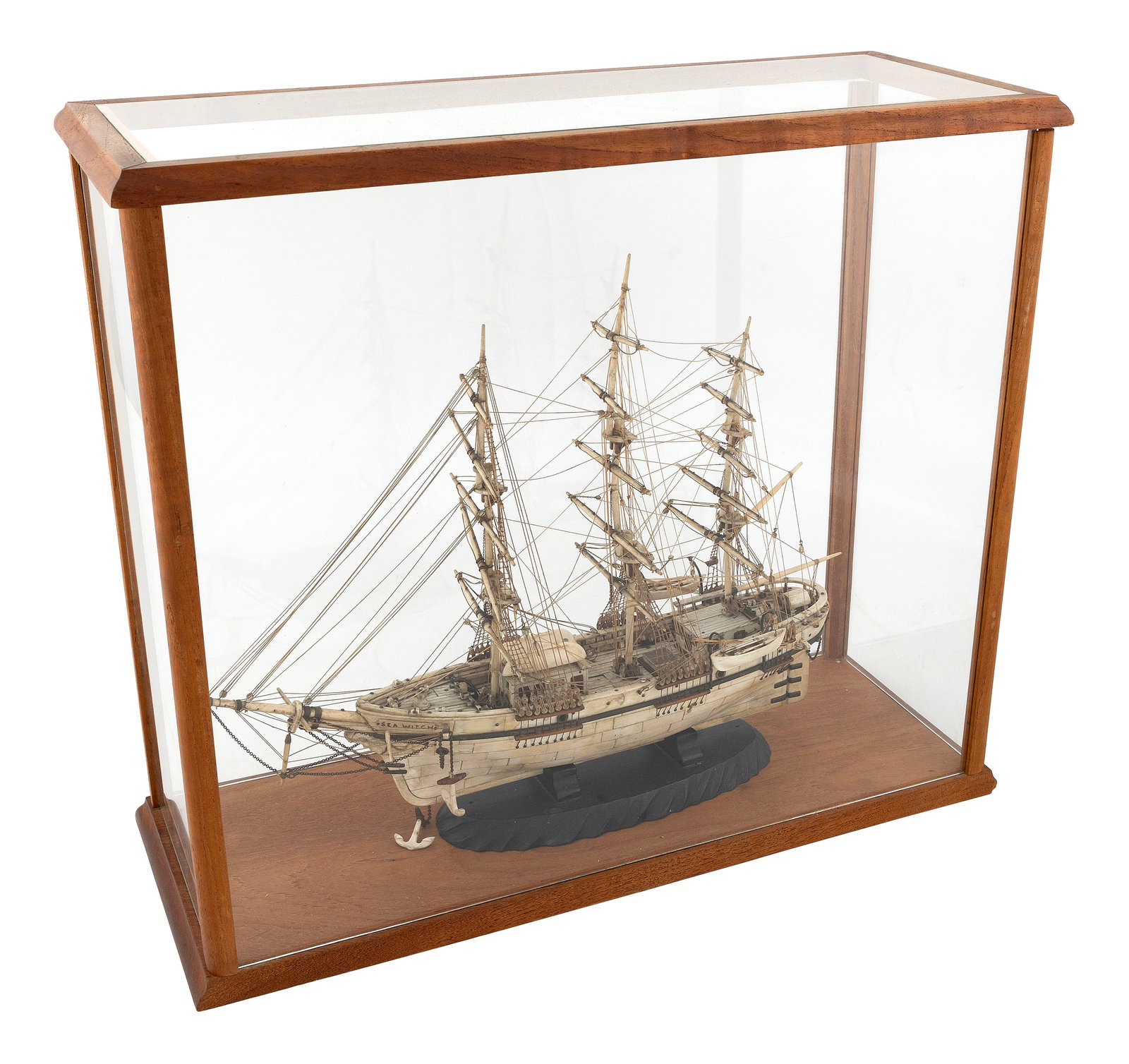 CASED MODEL OF THE WHALESHIP "SEA WITCH" 19th Century Case height 17.25". Length 20.25". Width 7.5".: CASED MODEL OF THE WHALESHIP "SEA WITCH"19th CenturyMade of whalebone, ebony and baleen. Nicely detailed, with two whaleboats on davits and two on the forward cabin. Displayed on an ebony cradle withi