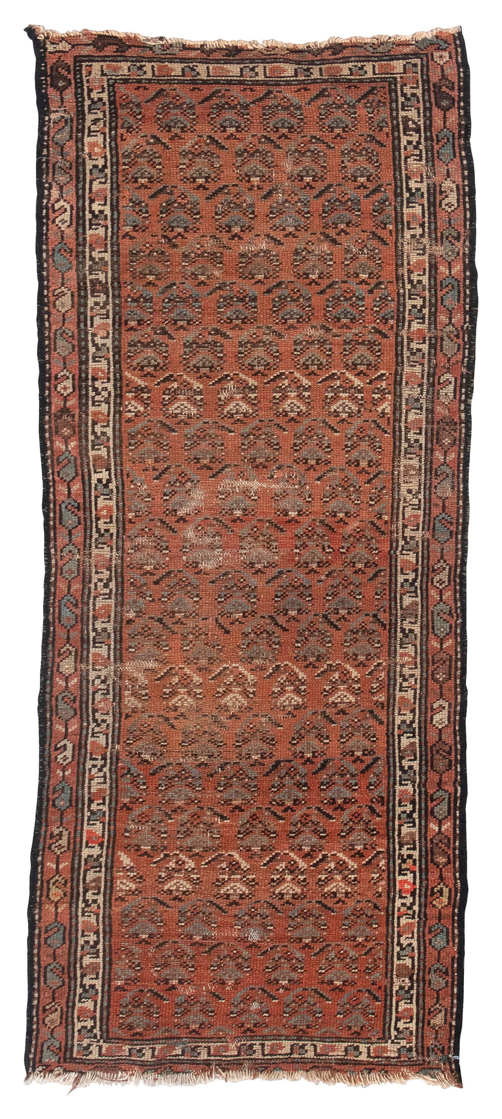 KURDISH RUG: 2'1" X 5'8" Early 20th Century: KURDISH RUG: 2'1" X 5'8"Early 20th CenturyRust red field is saturated with staggered rows of ivory, light blue and onyx boteh. Two narrow ivory and rust red borders.