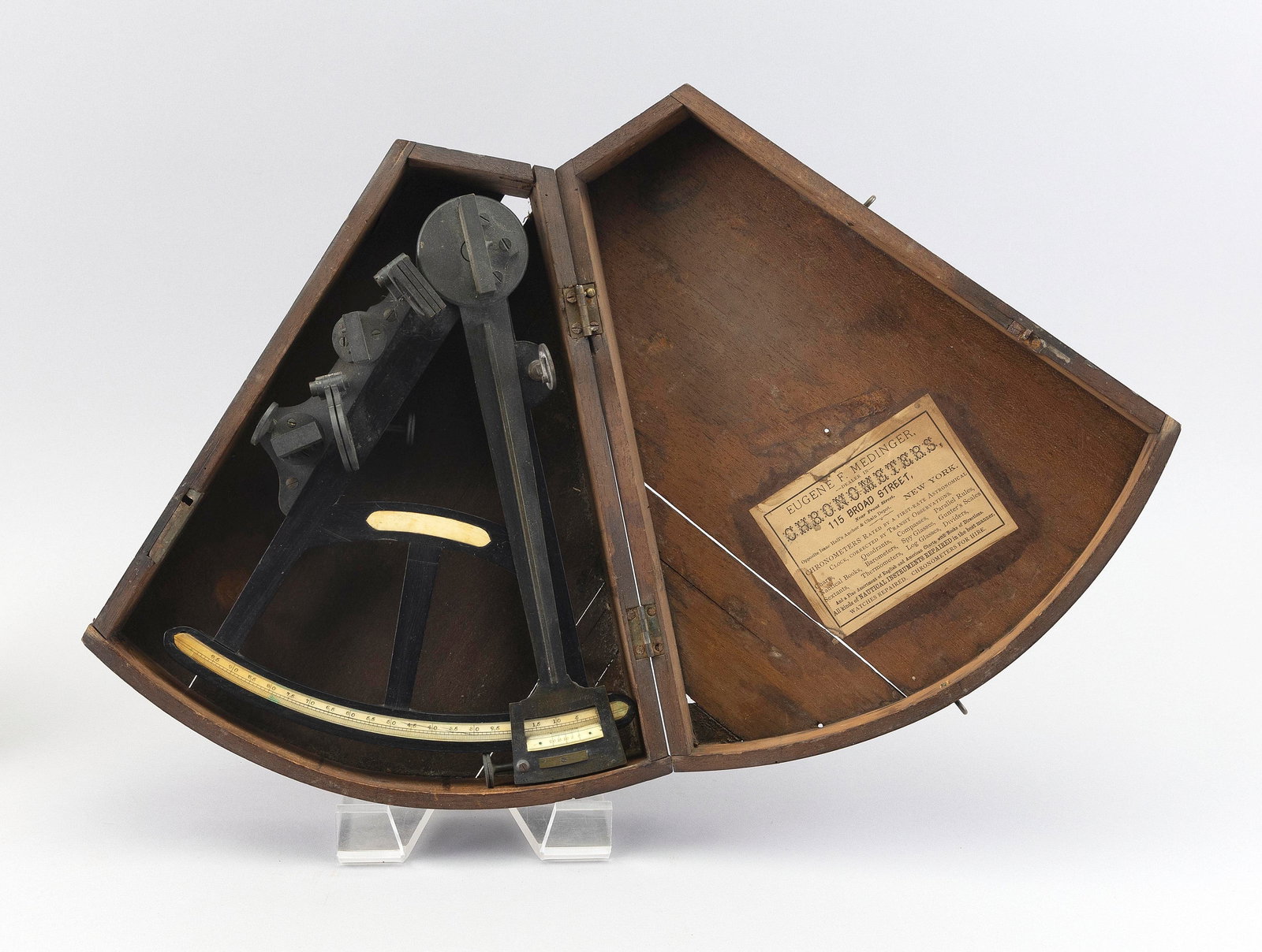 CASED EUGENE F. MEDINGER EBONY AND BRASS HADLEY'S QUADRANT New York, 19th Century Case height 4".: CASED EUGENE F. MEDINGER EBONY AND BRASS HADLEY'S QUADRANTNew York, 19th CenturyWedge-shaped mahogany case with paper label.Case height 4". Width 11.5". Length 13".