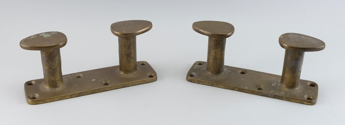 PAIR OF BRONZE BOLLARDS 20th Century Heights 5". Lengths 11.5". Widths 3.5". Weight approx. 25 lbs.