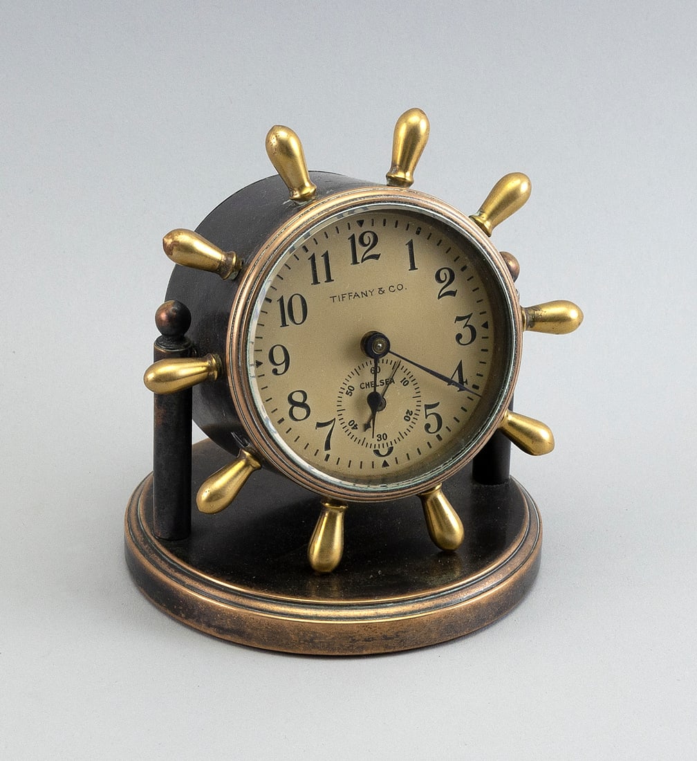 CHELSEA SHIP'S WHEEL DESK CLOCK MADE FOR TIFFANY & CO. First Half of the 20th Century Height 5".: CHELSEA SHIP'S WHEEL DESK CLOCK MADE FOR TIFFANY & CO. First Half of the 20th Century On brass stand. Height 5". Provenance: A Long Island Estate Collection.