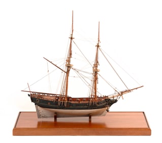 CASED MODEL OF A TWO-MASTED GUNBOAT 20th Century Case height 28". Length 28". Width 12".