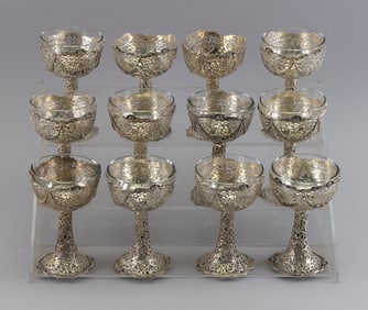 SET OF TWELVE CONTINENTAL SILVER CHAMPAGNE COUPES WITH GLASS LINERS Late 19th/Early 20th Century