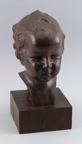 CARVED WALNUT BUST OF A CHILD Early 20th Century Height 14". Base 6.375" x 6.375".