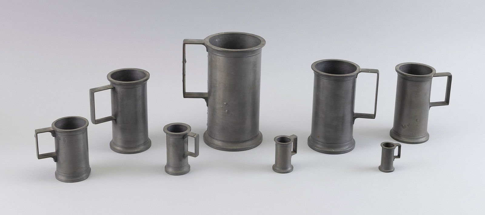 GRADUATED SET OF EIGHT PEWTER MEASURES 19th Century Heights from 2" to 7". (1 of 1)