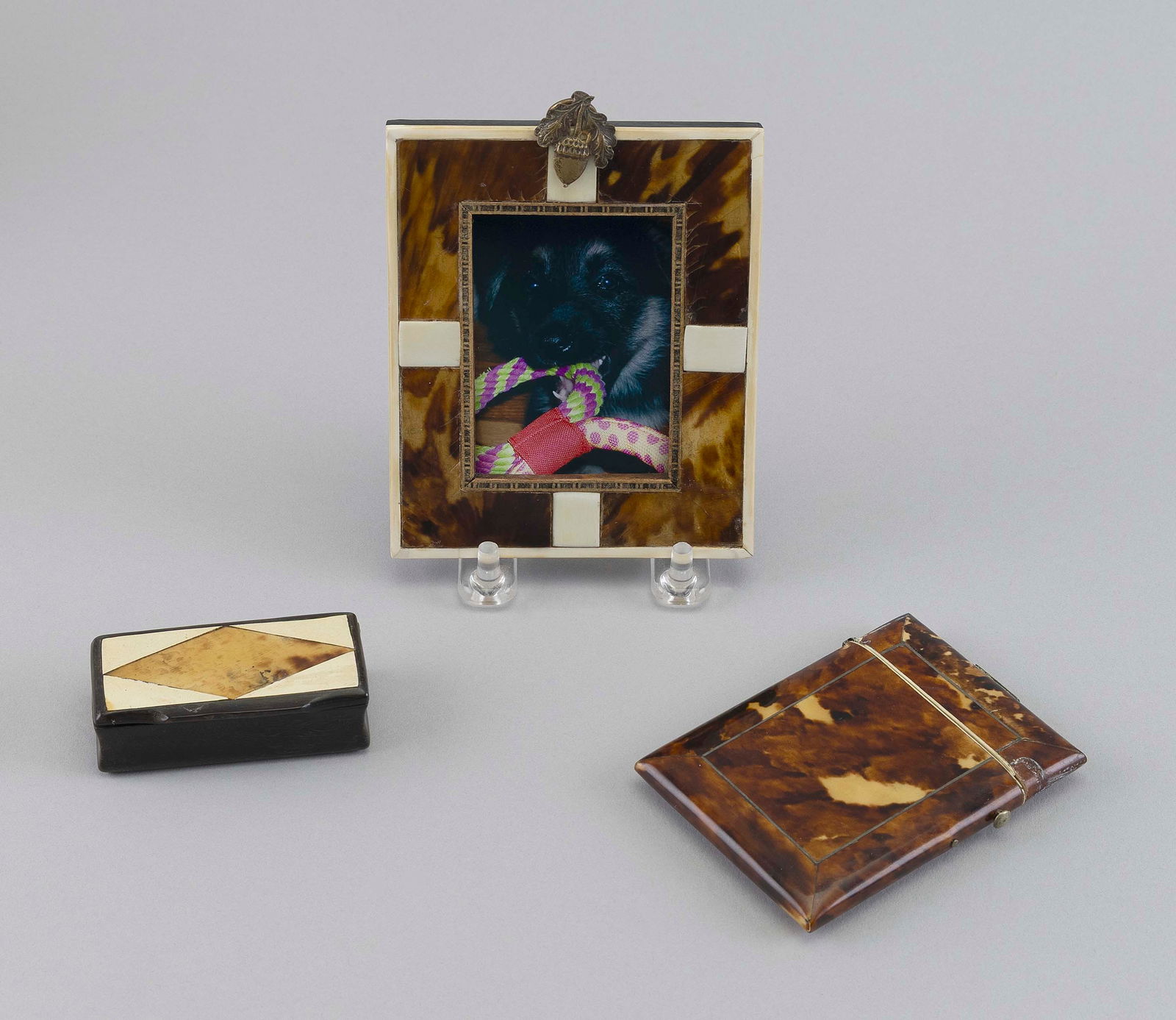 THREE SHELL, BONE AND IVORY ITEMS 19th Century Frame 5" x 3.75". Aperture 2.75" x 2".: THREE SHELL, BONE AND IVORY ITEMS19th CenturyA box and a frame with marine ivory and bone inlay, and a card case with broken hinge.Frame 5" x 3.75". Aperture 2.75" x 2".